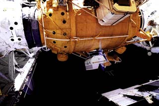 Optical Properties Monitor (OPM) attached below the docking module. 